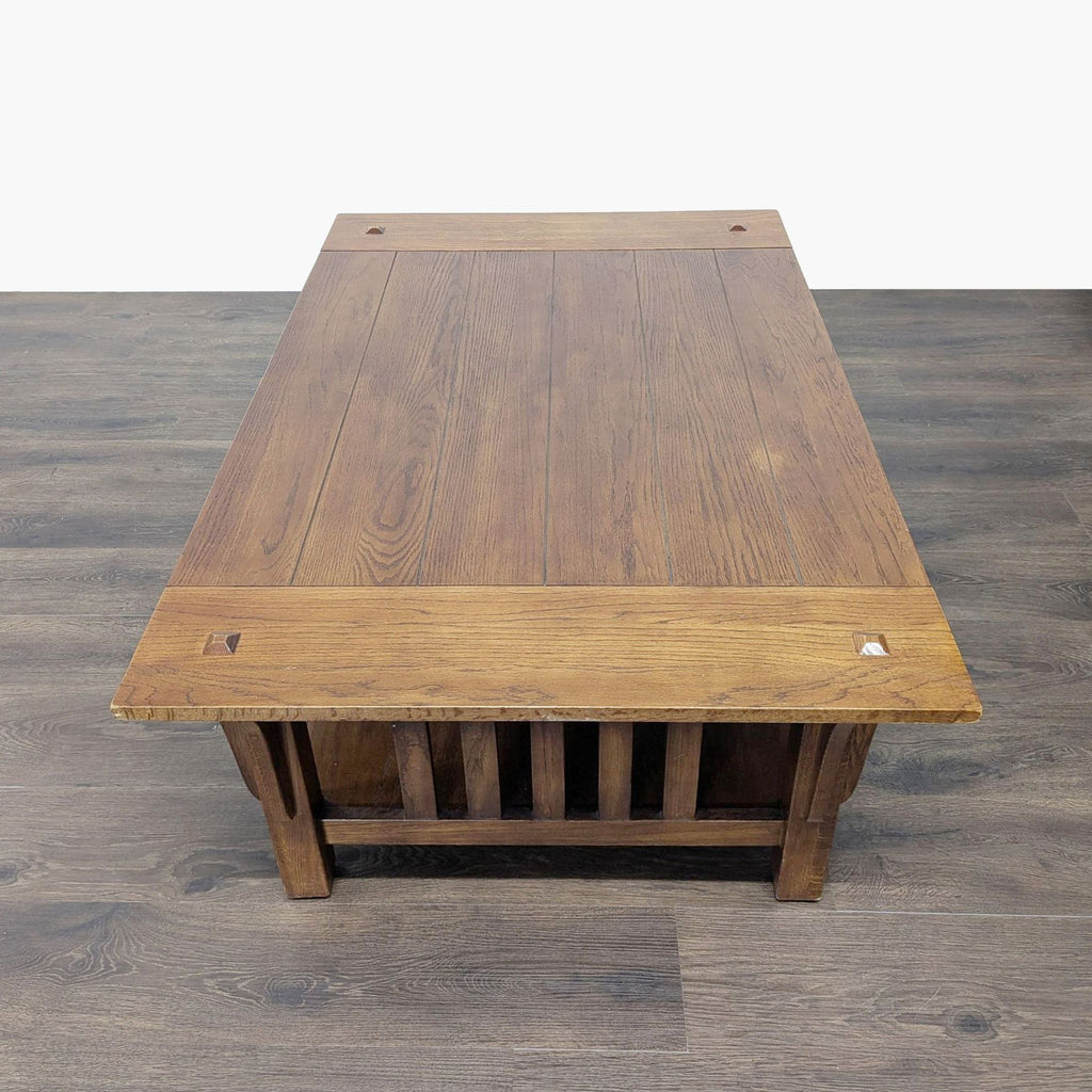 2. Top-down view of a Reperch brand coffee table, displaying the rectangular wood grain surface and corner accents.
