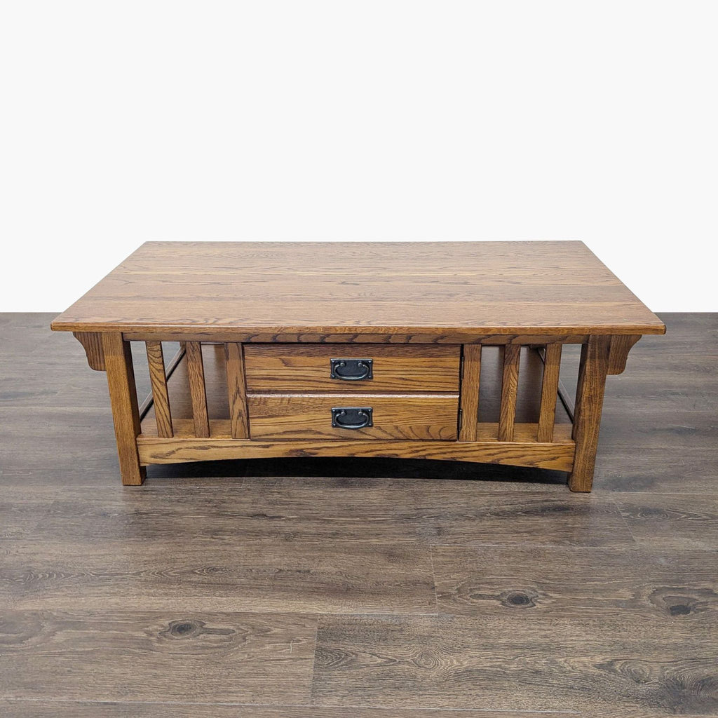 1. Reperch wooden coffee table with two front drawers and slatted sides, shown on a wood floor.