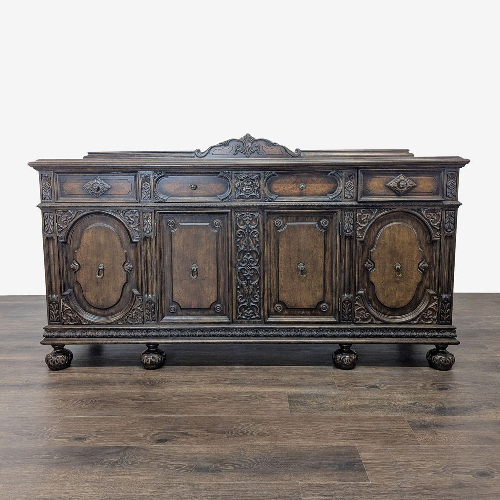1. Ornate wooden sideboard with carved details, three drawers, and two cabinets, Reperch brand, front view.  