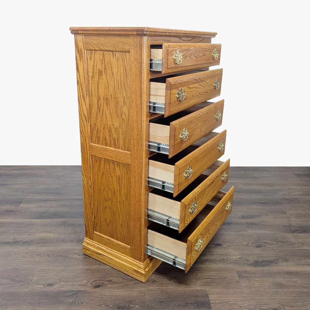 2. Side angle showing all six drawers of the Reperch oak dresser partially open on metal glides.