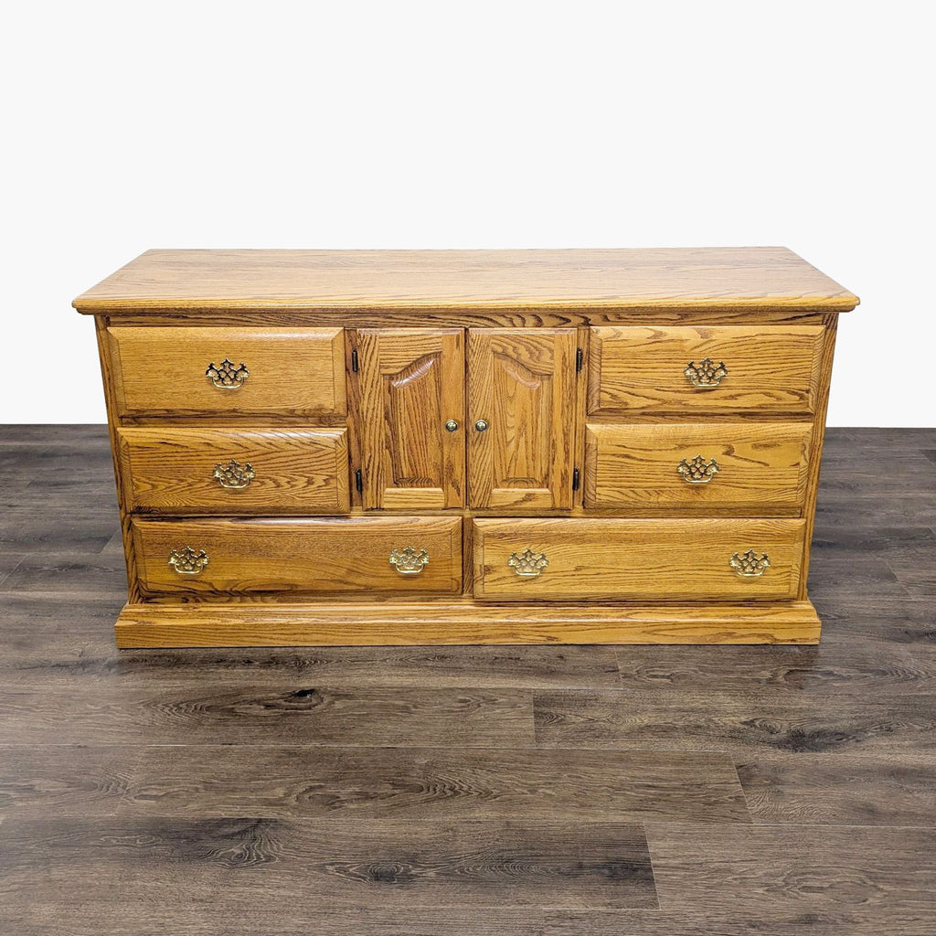 1. Reperch oak dresser with 8 drawers, classic design, wood grain finish, on dark floor, all drawers closed.