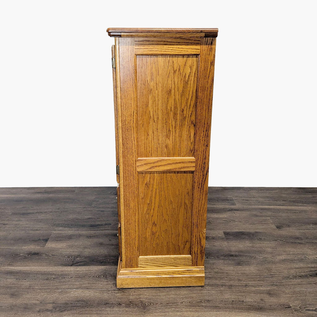 3. Side profile view of a solid oak Reperch dresser, showing wood grain detail and panel design.