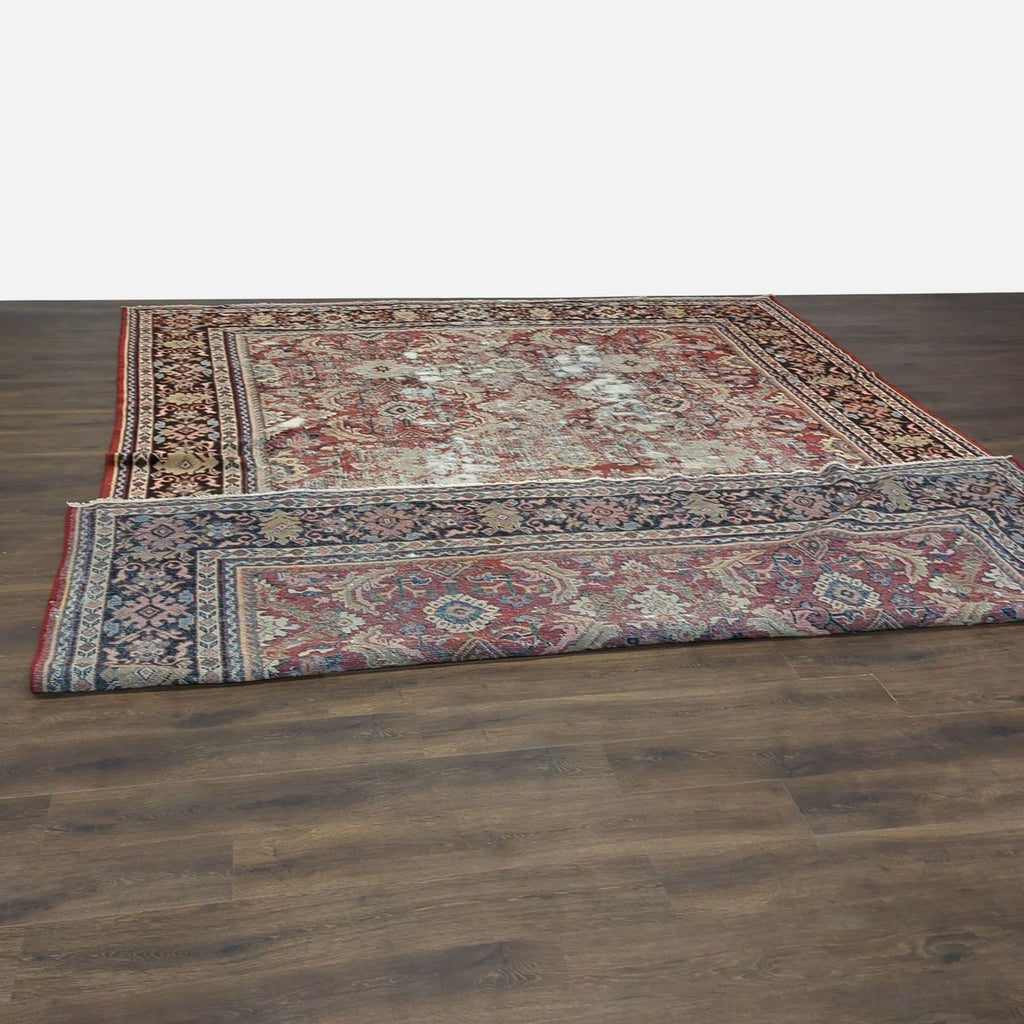 1. Vintage Persian hand-knotted wool rug by Reperch, featuring intricate patterns and signs of wear on wooden floor.