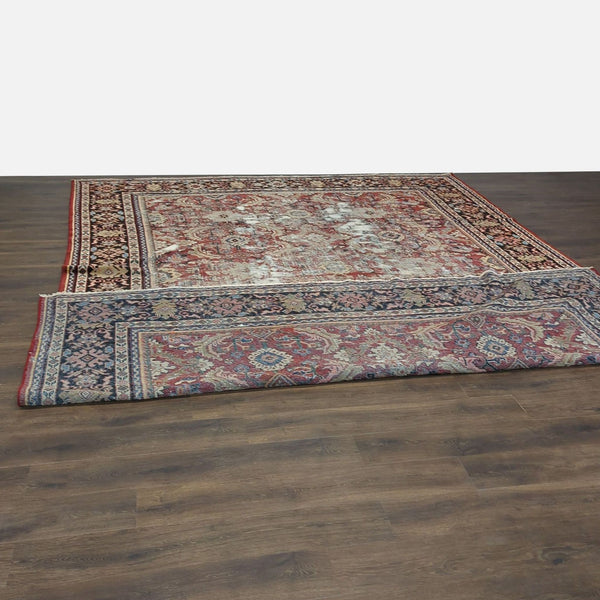 1. Vintage Persian hand-knotted wool rug by Reperch, featuring intricate patterns and signs of wear on wooden floor.