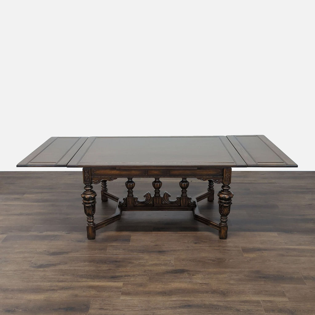 2. Reperch dining table fully extended, showcasing decorative legs and elegant classic design on wooden floor.