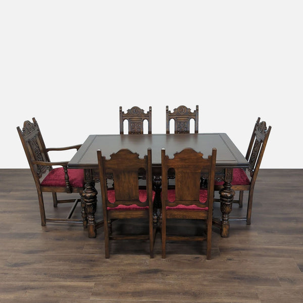 1. Reperch solid oak dining set with six ornate chairs, red upholstered seats, and detailed carved accents.