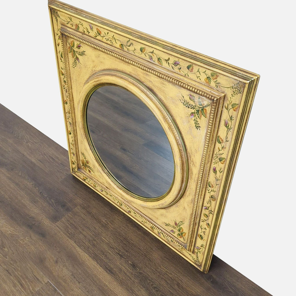 2. Angled view of a handmade, antiqued Roma Moulding mirror with ornate floral wood frame detailing.  