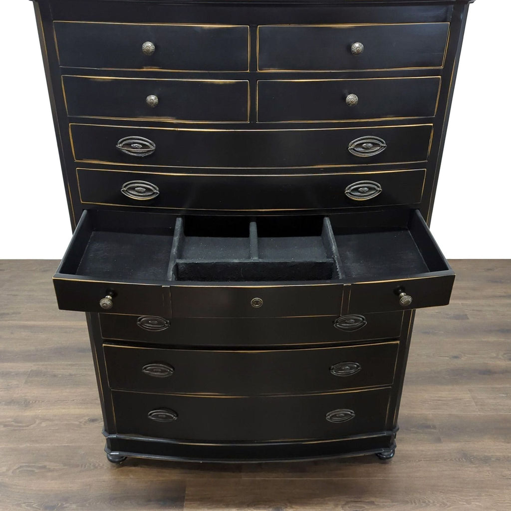 1. Reperch black dresser with multiple drawers, one open to reveal organizers, on a wood floor.