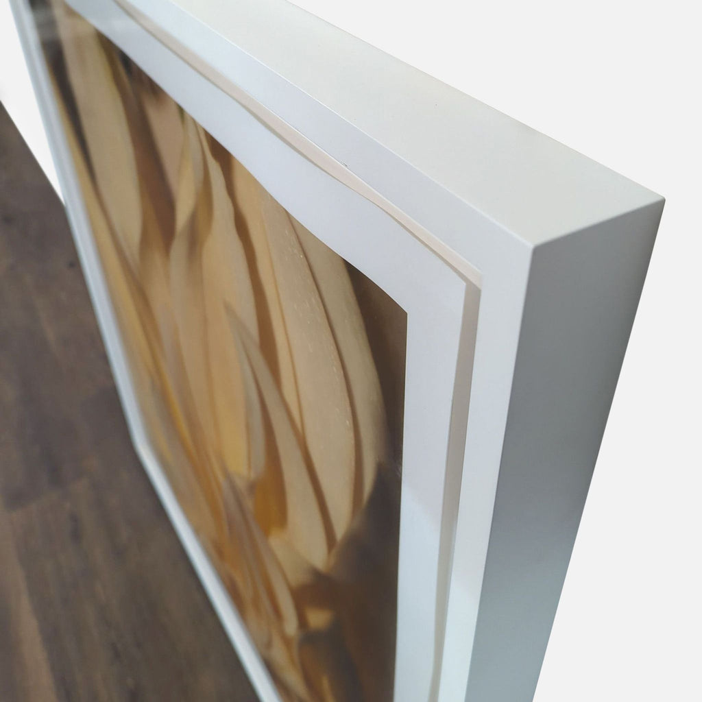 1. Close-up side view of a Reperch print featuring a yellow flower, framed in a white shadow box.