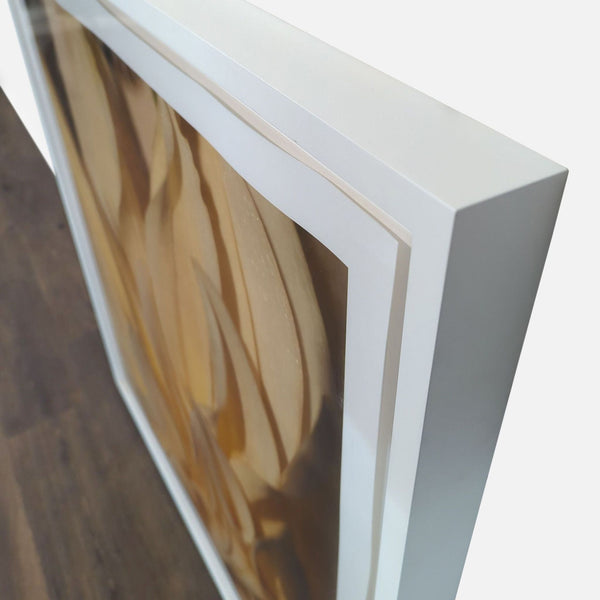 1. Close-up side view of a Reperch print featuring a yellow flower, framed in a white shadow box.