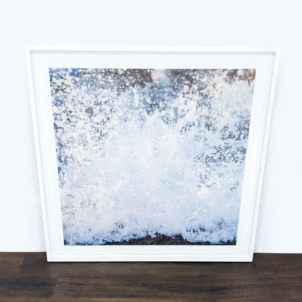 - Framed Reperch print featuring an abstract splash of water, categorized under Prints & Maps, on a wood floor.