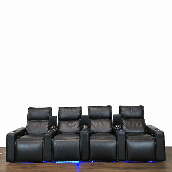 1. Four black Octane recliners in Italian leather, with blue LED lighting and built-in cupholders, seen from the front.