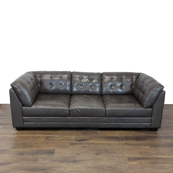 Reperch 3-seat sofa in faux leather with tufted backrest, shown on wood floor, full frontal view.  