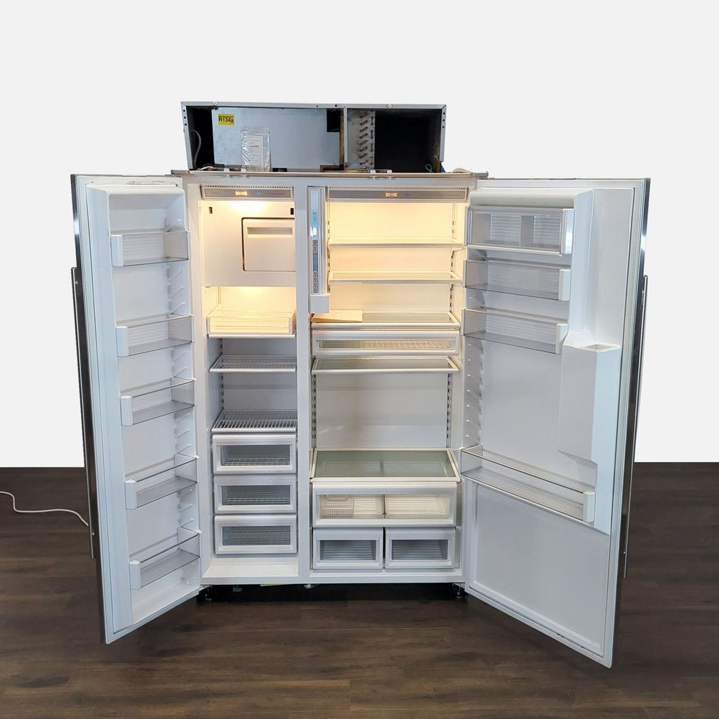 2. Open Sub-Zero refrigerator showing adjustable shelves, multiple drawers, and spacious door bins for storage.