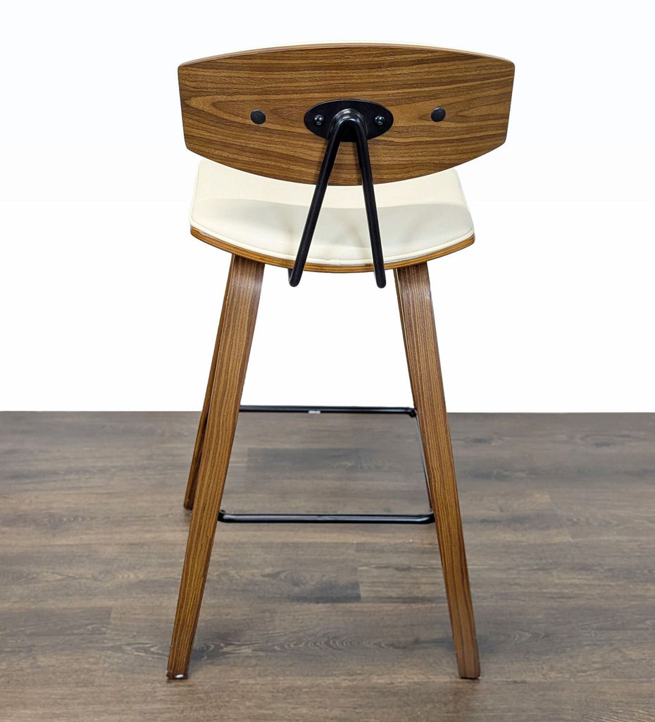 2. Rear view of Armen Living Mid-Century stool in wood and cream faux leather, featuring metal supports.