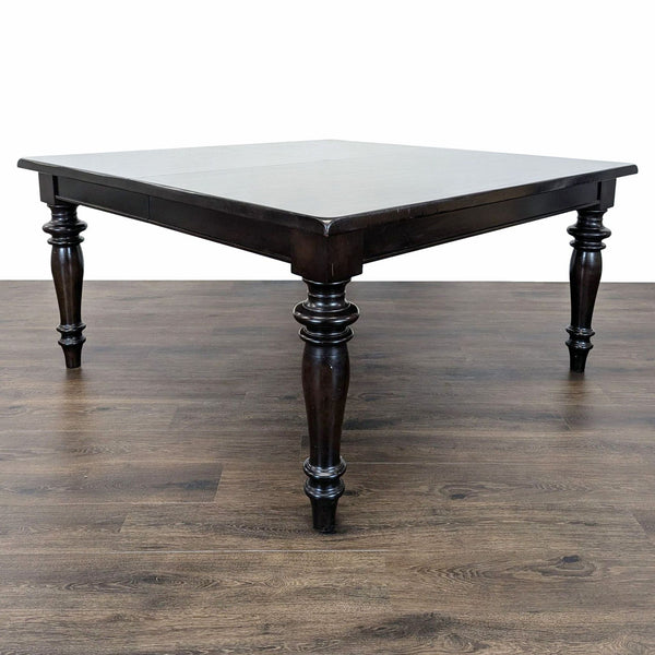 1. Reperch dining table with turned legs, shown at 60 inches without leaves on a wood floor.