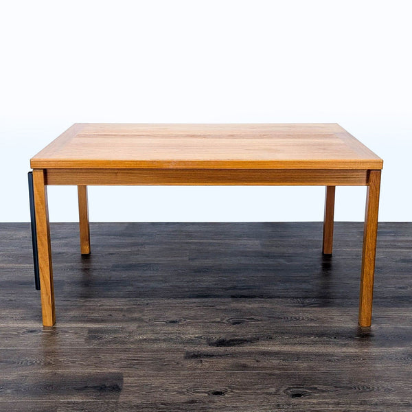 1. Rectangular Reperch dining table shown without leaves, measuring 55 inches, on a dark wood floor.  