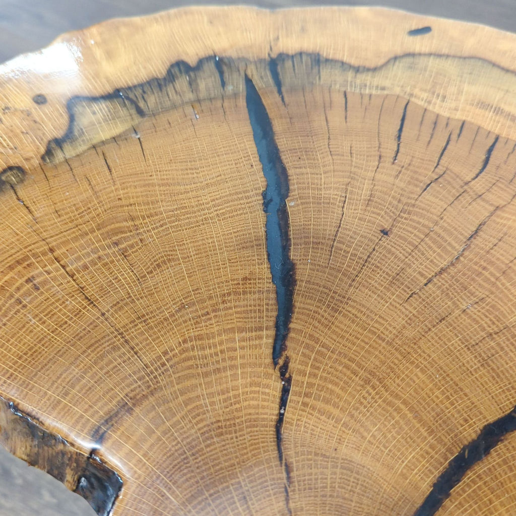 1. Close-up of a Reperch side table top, showing rich wood grain and natural cracks with a smooth finish.