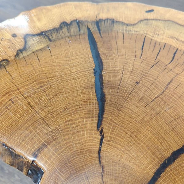 1. Close-up of a Reperch side table top, showing rich wood grain and natural cracks with a smooth finish.