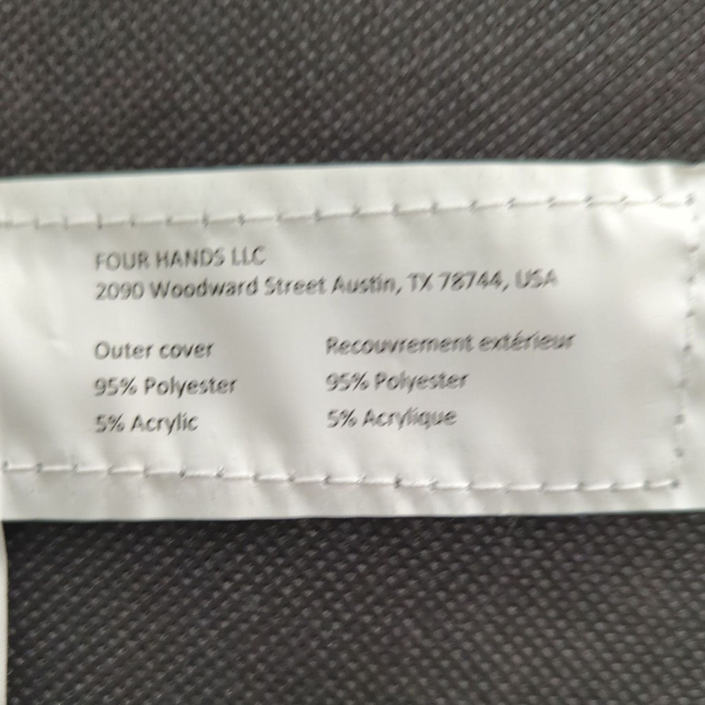2. Fabric tag for a Four Hands 3-seat sofa displays the outer cover is 95% polyester and 5% acrylic.
