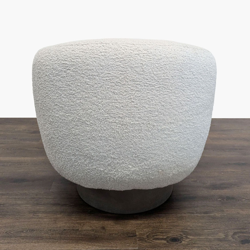 Plush, rounded lounge chair in light textured fabric on wood flooring, category Lounge, brand Interlude Home.  