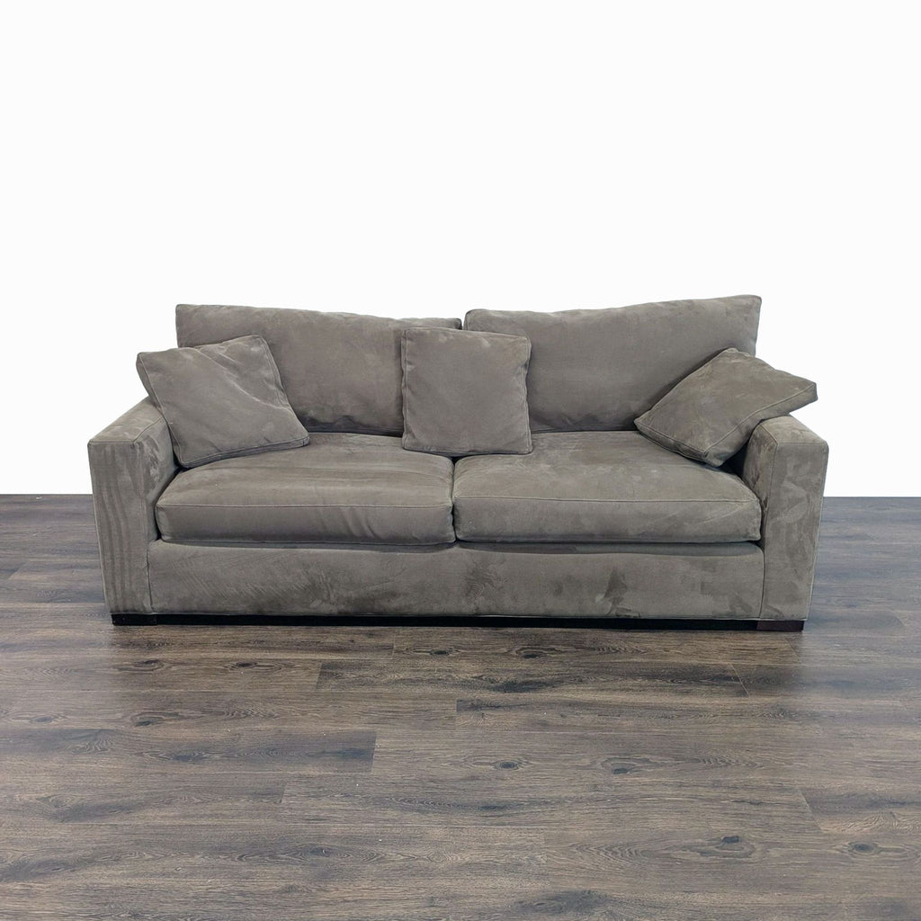 Gray Crate and Barrel 3-seat sofa with angled back, track arms, and feather-down blend cushions, shown from the front.