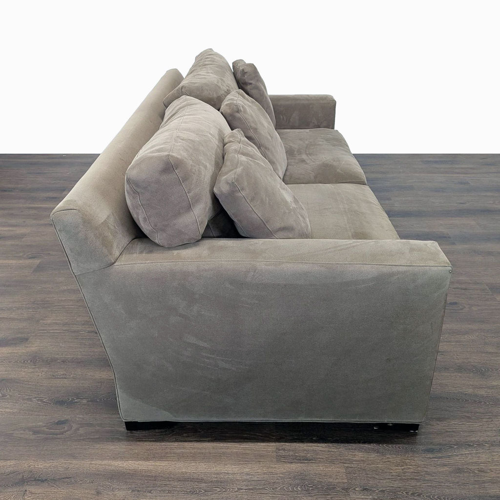 Side view of Crate and Barrel 3-seat sofa, highlighting angled back and deep, plush feather-down blend seat cushions.