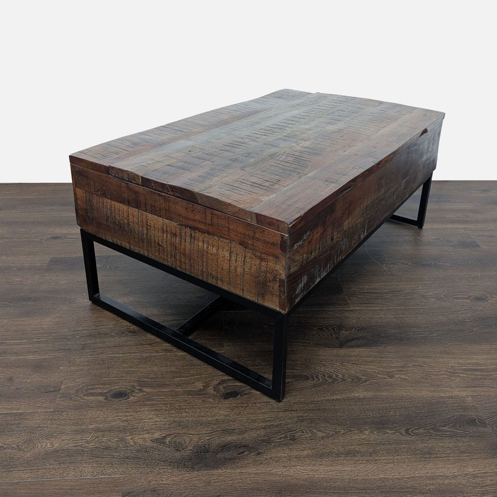 3. Signature Design by Ashley coffee table featuring a solid wood block top and sleek black metal legs.
