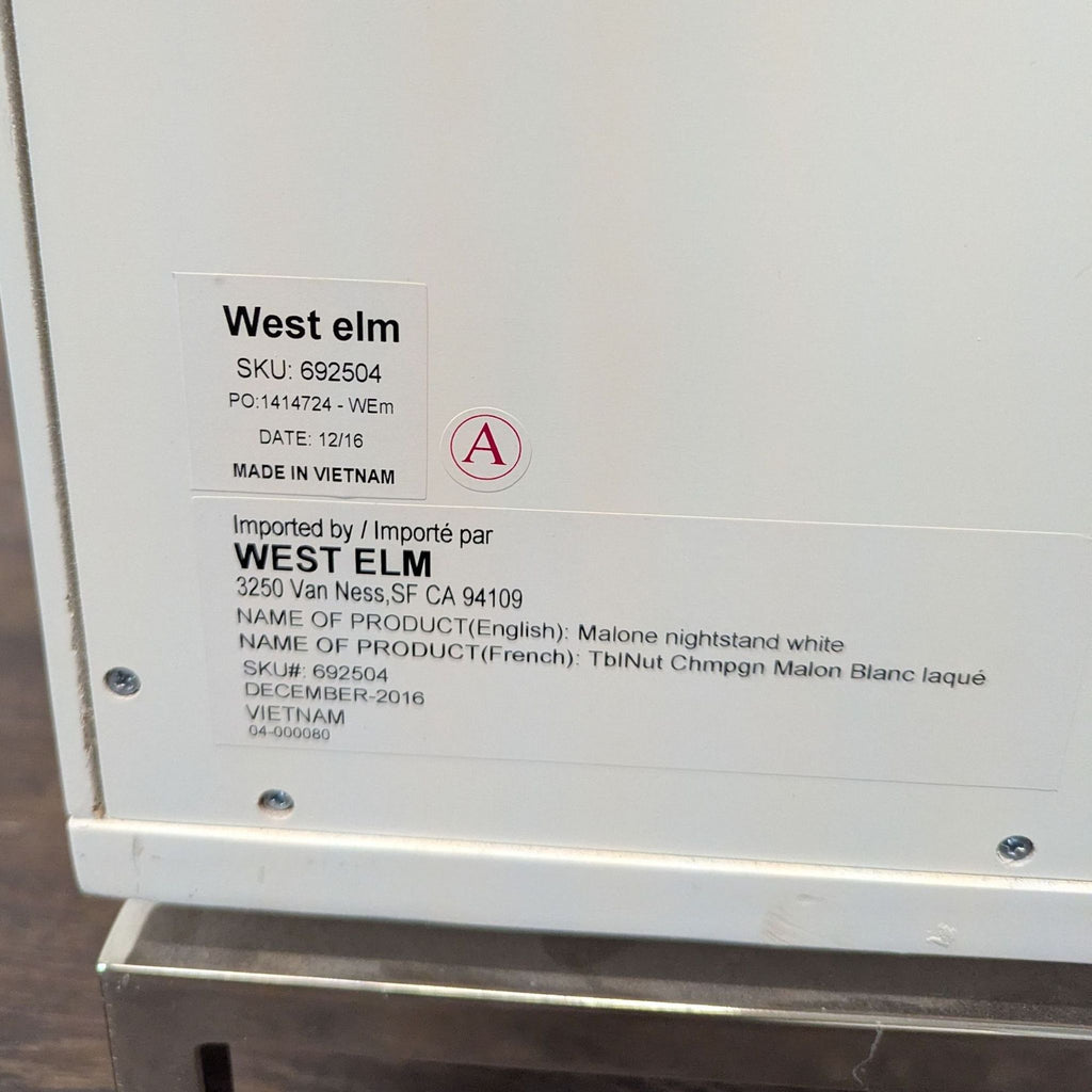 Close-up of product label for West Elm Malone nightstand, listing SKU, product name, and manufacturer details.