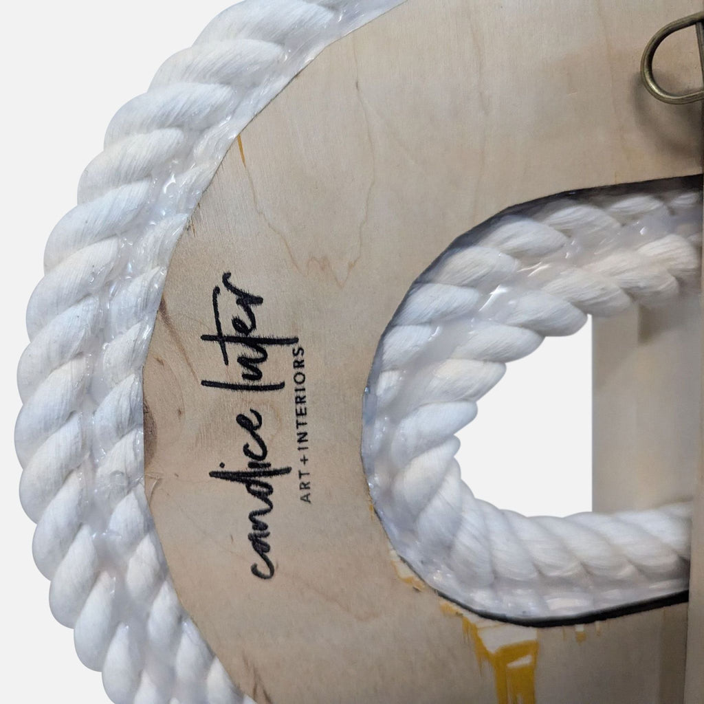 2. Close-up of white rope art mounted on curved wood, stamped with "candice luter ART + INTERIORS" branding.  