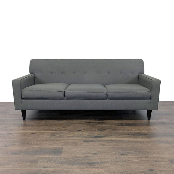 1. Max Home Furniture 3-seat sofa with tapered wood legs, button tufted back, and piped trim, front view.  
