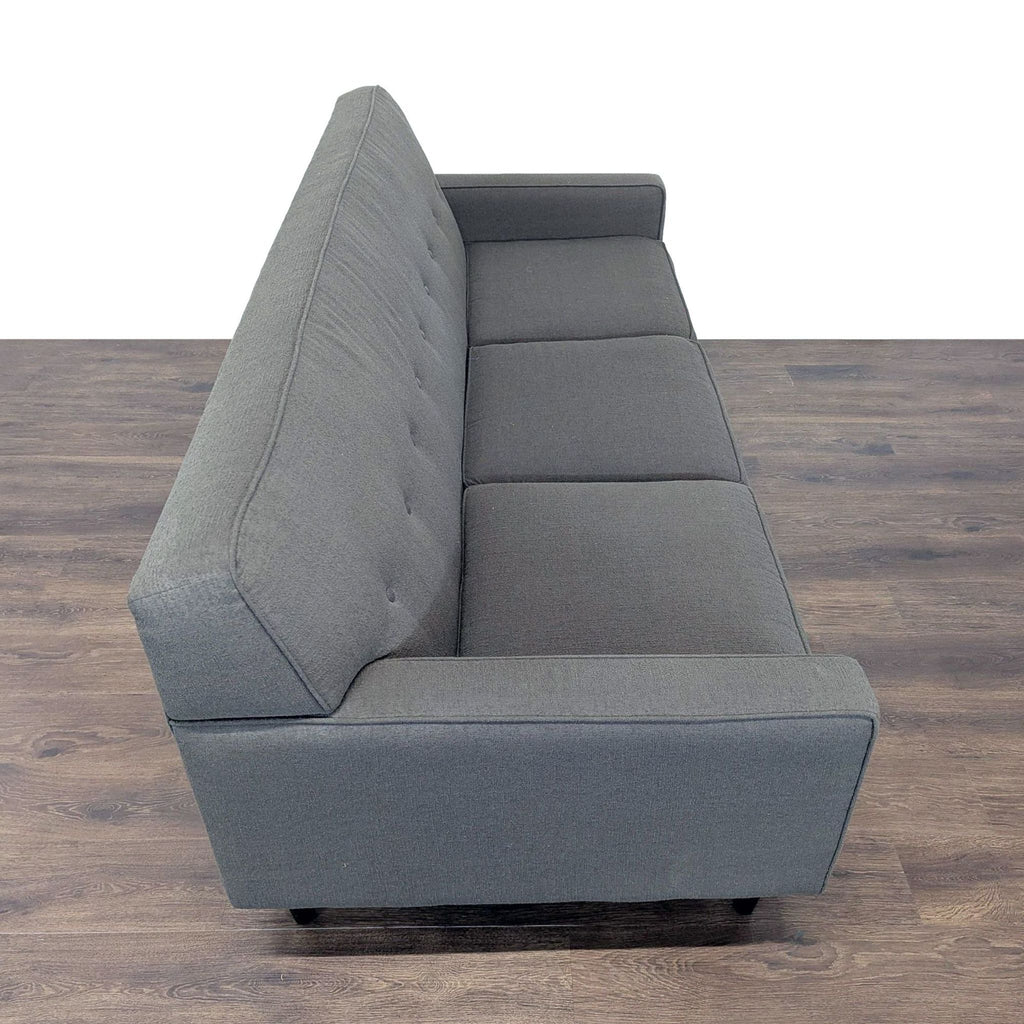 3. Top-down side view of gray Max Home Furniture 3-seat sofa, showing button tufting and sleek wood legs.