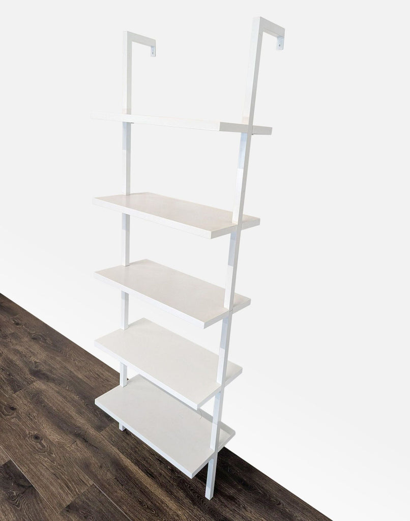 Angled view of a Nathan James wall-mounted bookshelf with five fixed painted laminate shelves.