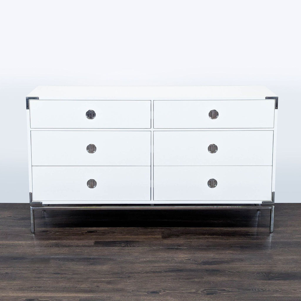 1. Modern white West Elm dresser with six drawers, chrome handles, and metal legs on a dark wood floor.