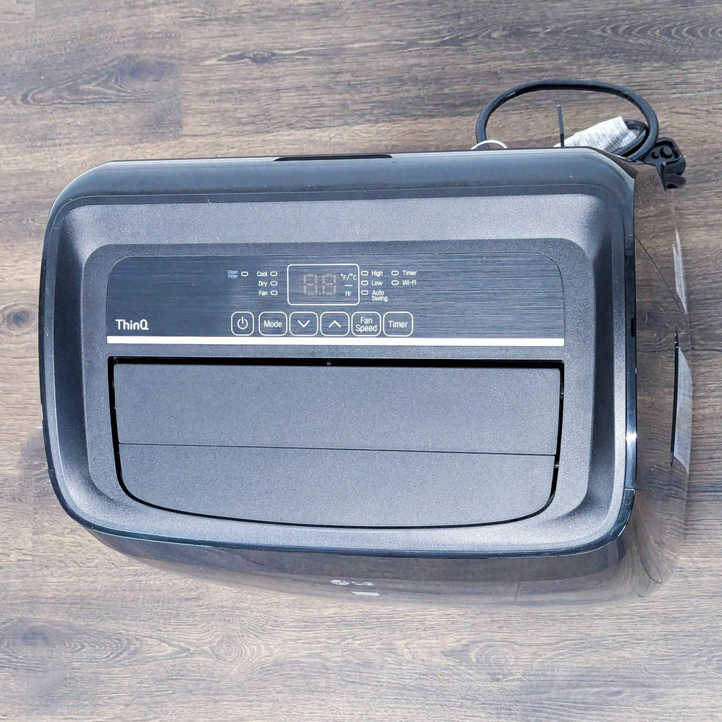 LG Portable Air Conditioner – Sleek Black, Easy-to-Move Cooling Unit