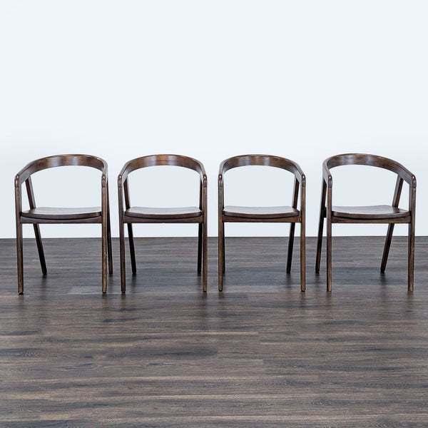 Set of four Reperch dining chairs with curved wooden backrests and dark finishes, arranged in a row.