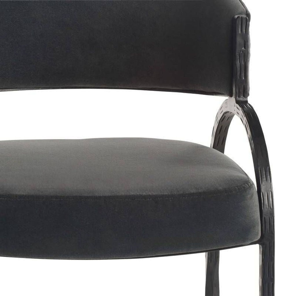 2. Front view of the Arteriors Home lounge chair, showing its rounded seat and textured metal frame.