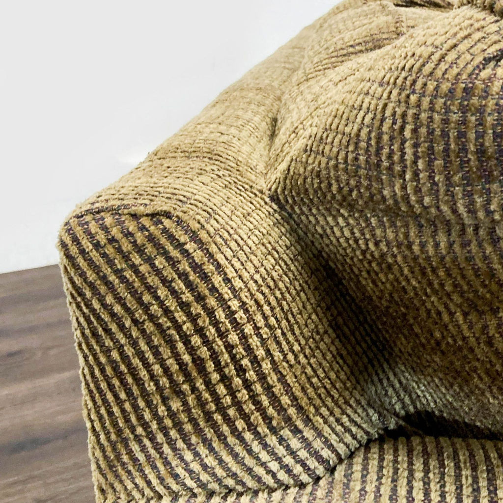 3. Close-up of the ribbed corduroy upholstery on a Flexsteel sofa cushion, showing fabric texture details.