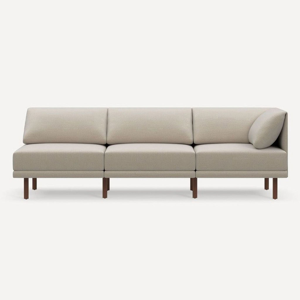 Front view of a Burrow 3-seat sofa in light beige fabric with wooden legs and supportive cushions.  