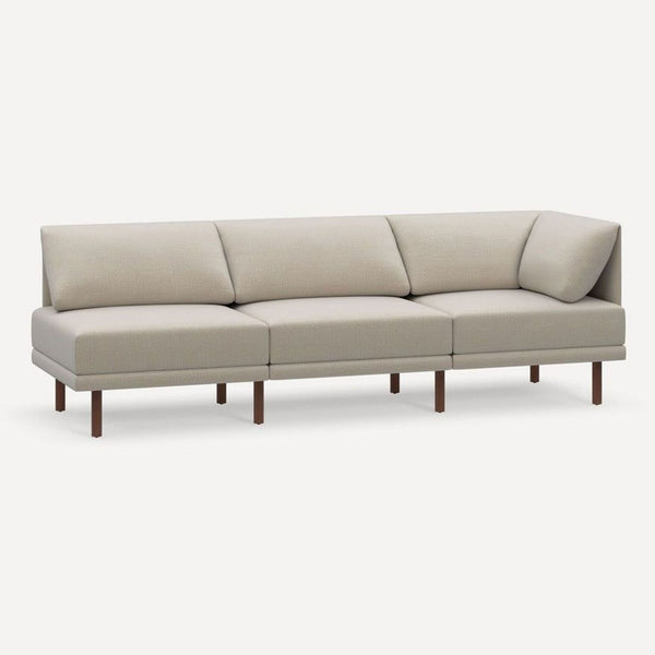 Beige Burrow 3-seat sofa with clean lines and minimalist design, angled view showing wooden legs.  
