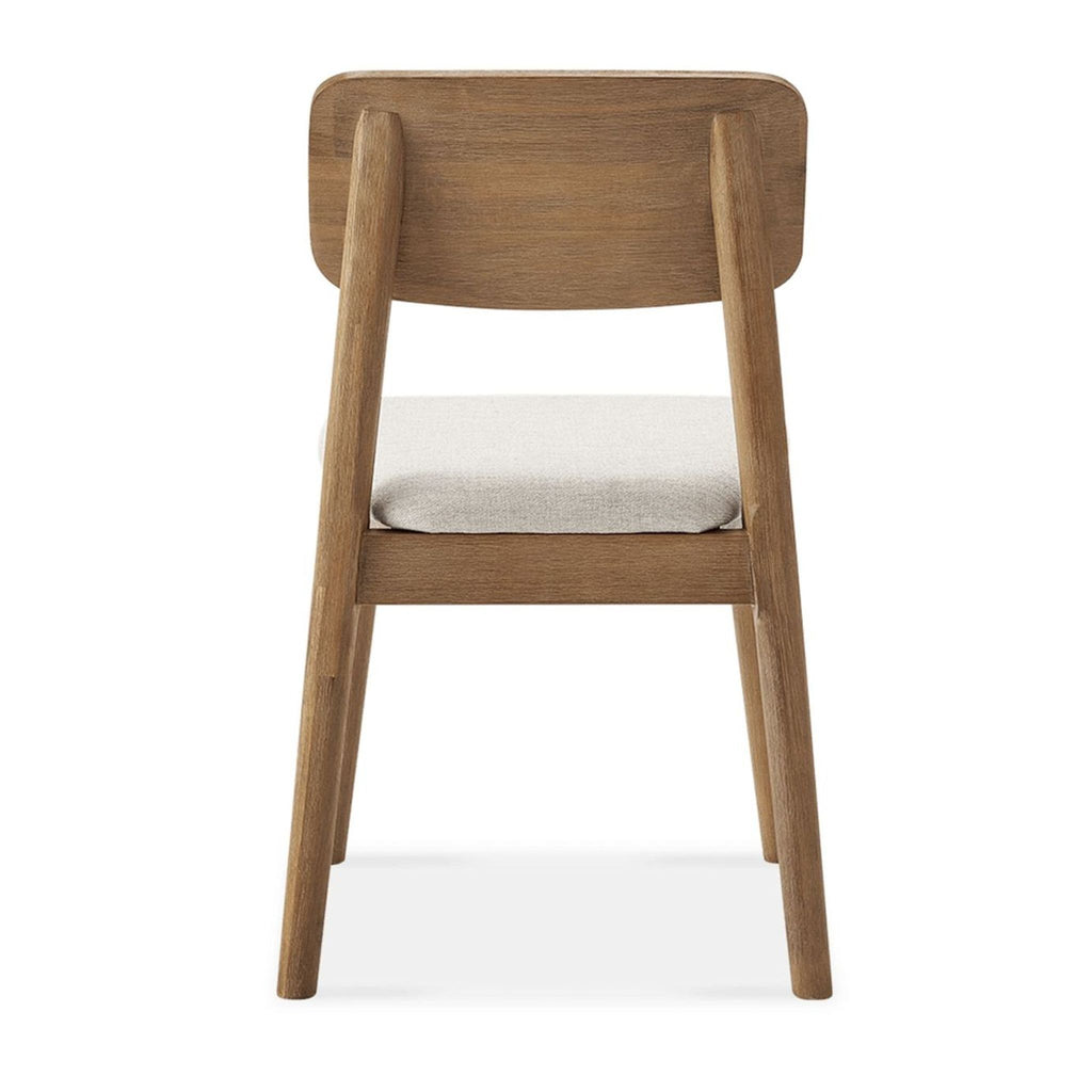 2. Rear view of the Castlery dining chair featuring a wooden frame and cushioned fabric seat.