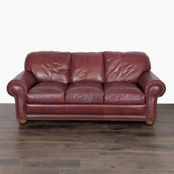 1. Front view of a Viewpoint Leather Works 3-seat sofa in rich brown leather with rolled arms and nailhead trim.  
