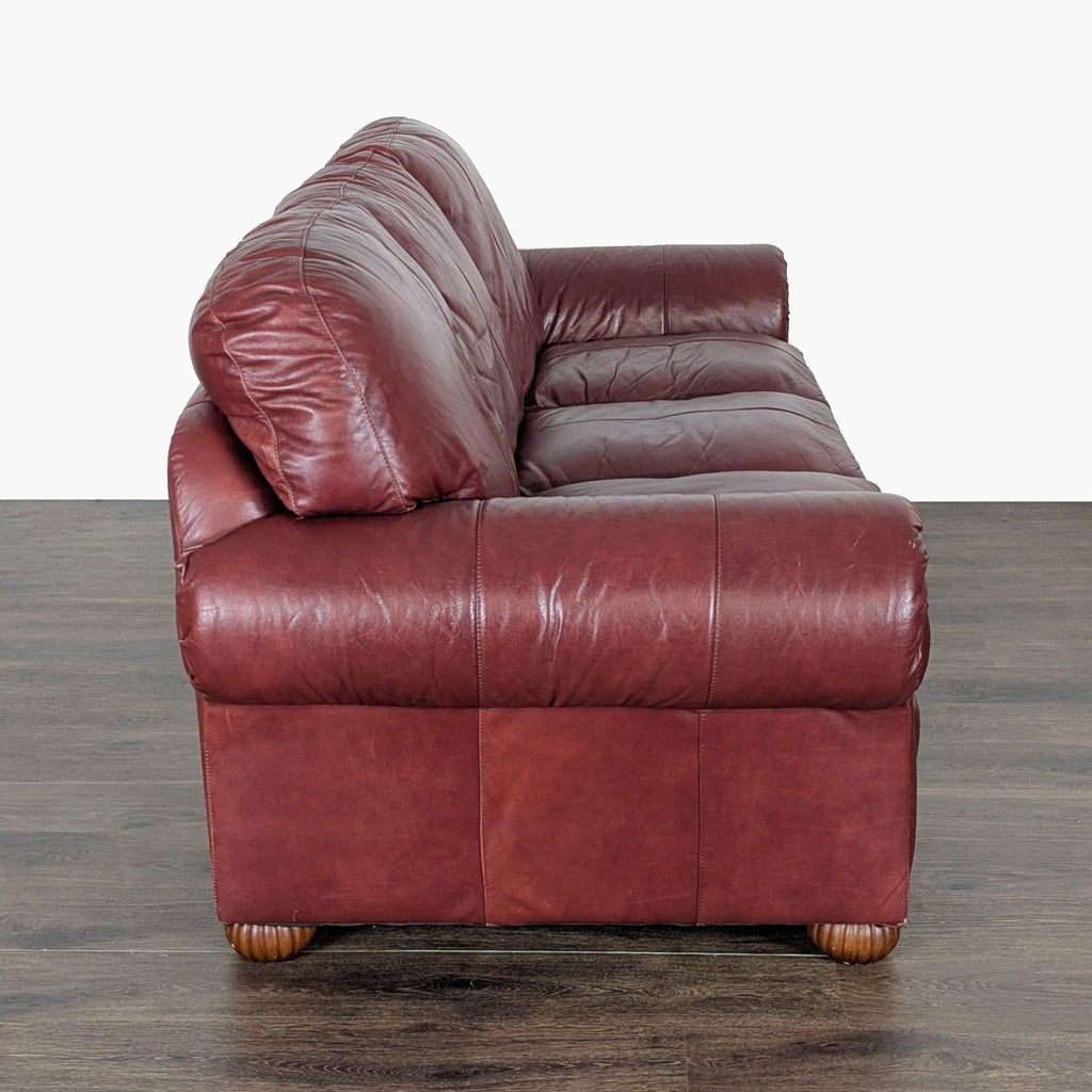 2. Side profile of the Viewpoint Leather Works leather 3-seater sofa showing plush cushioning and classic arm.  