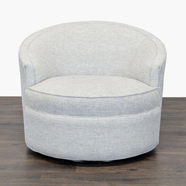 1. Front view of a modern light gray lounge chair with rounded design and soft fabric from Macy’s.
