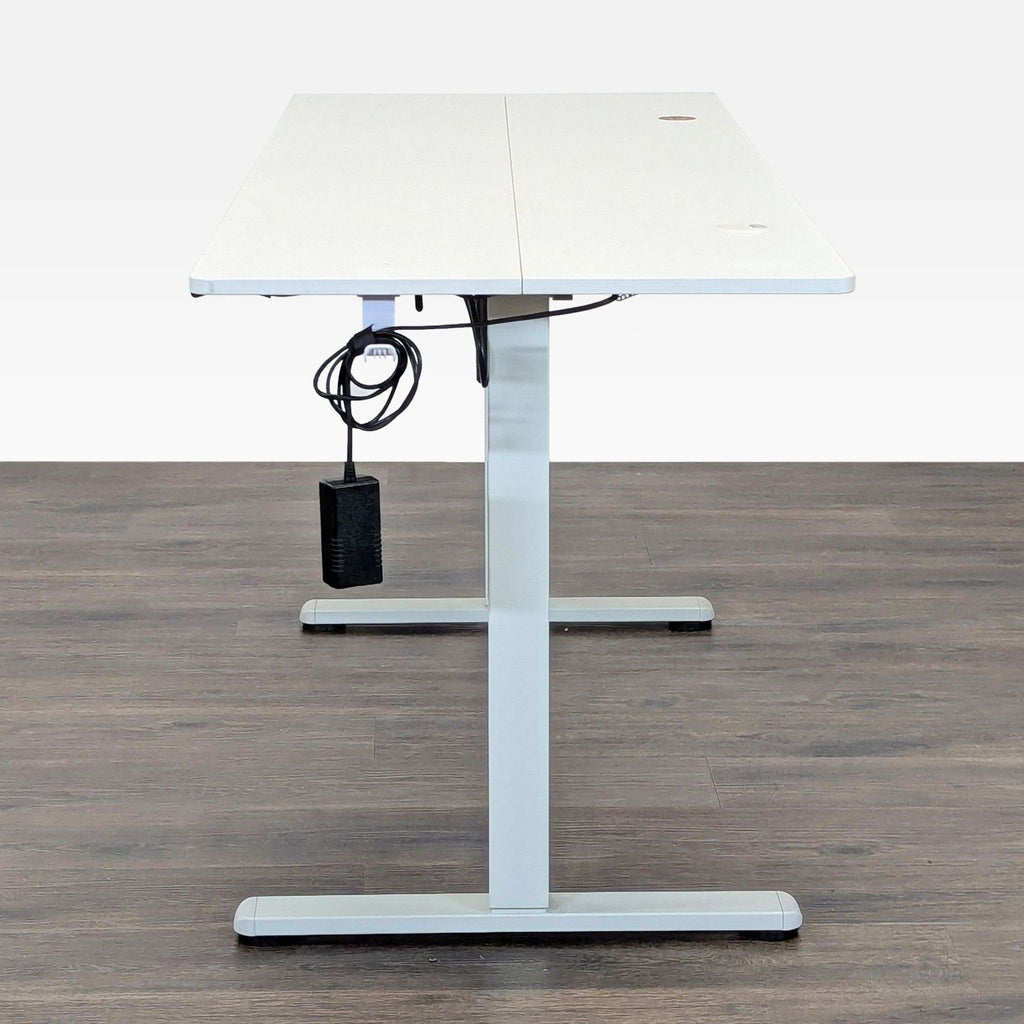 3. Side view of Hengjian Home Furnishings electric desk featuring space-saving hooks and a wide, organized work surface.