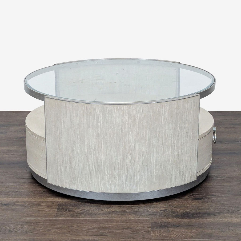 3. Rear view of a Reperch round coffee table with light wood finish and glass top, no visible drawer.