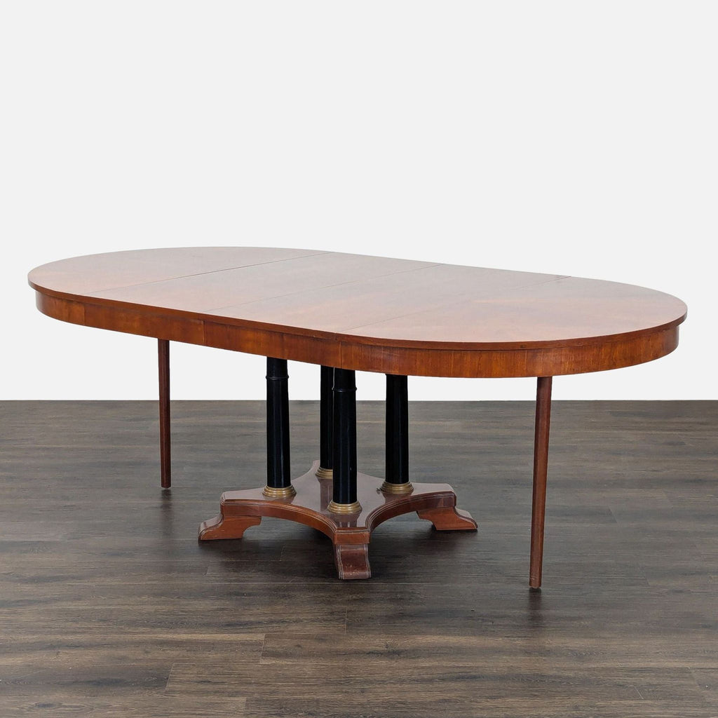 2. Side angle of Ethan Allen oval dining table with one leaf extended, displaying pedestal and support legs.