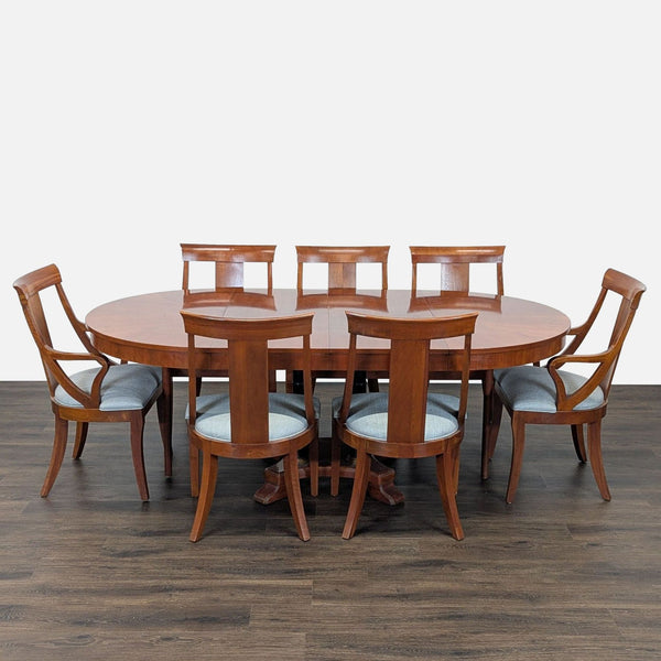 1. Ethan Allen dining set with extendable wooden table and seven matching upholstered chairs, ideal for gatherings.  