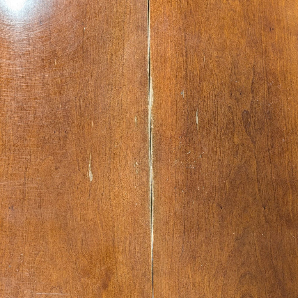 Circular table with two leaves to make two different sized ovals. 2 armed host chairs and 5 other chairs. Also 1 damaged chair which could be repaired. 
One leaf is installed. 
View of legs and base. 
Showing leaf mechanism. 
Side chair and host chai