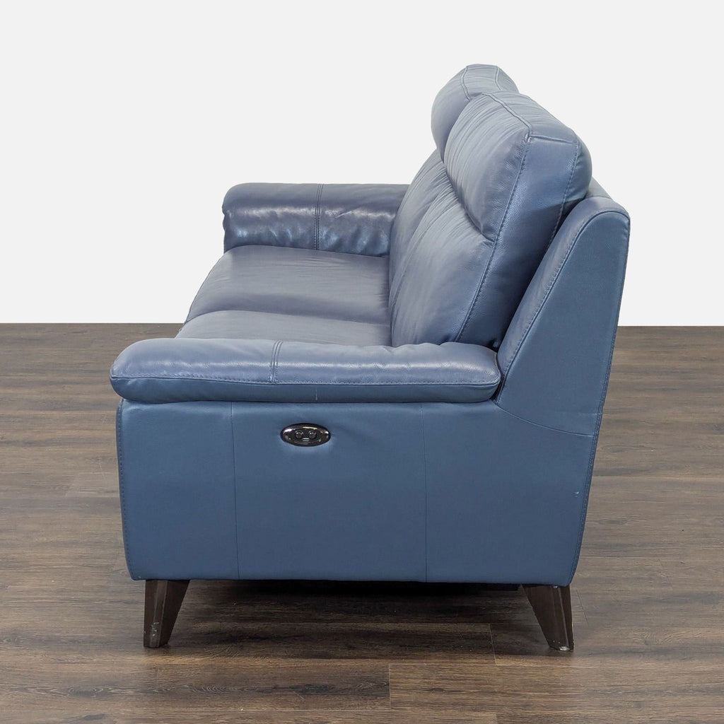 Side view of a blue Reperch electric couch showing button control for reclining function on one arm.  